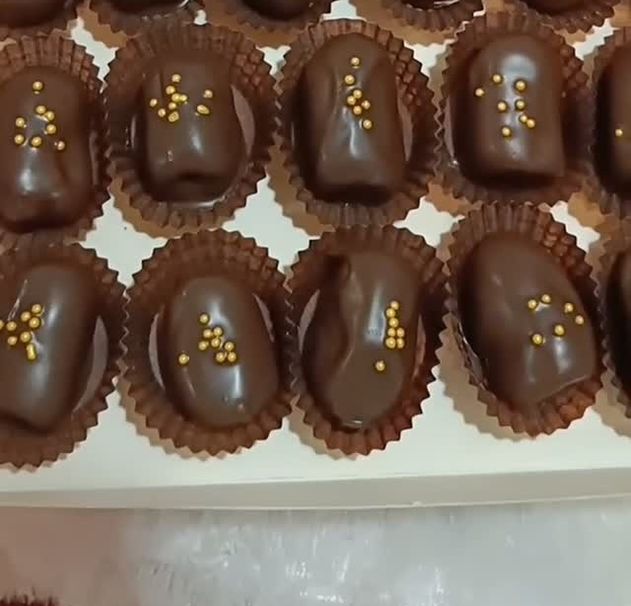 Homemade chocolate bites with gold sprinkles by Choco Bites